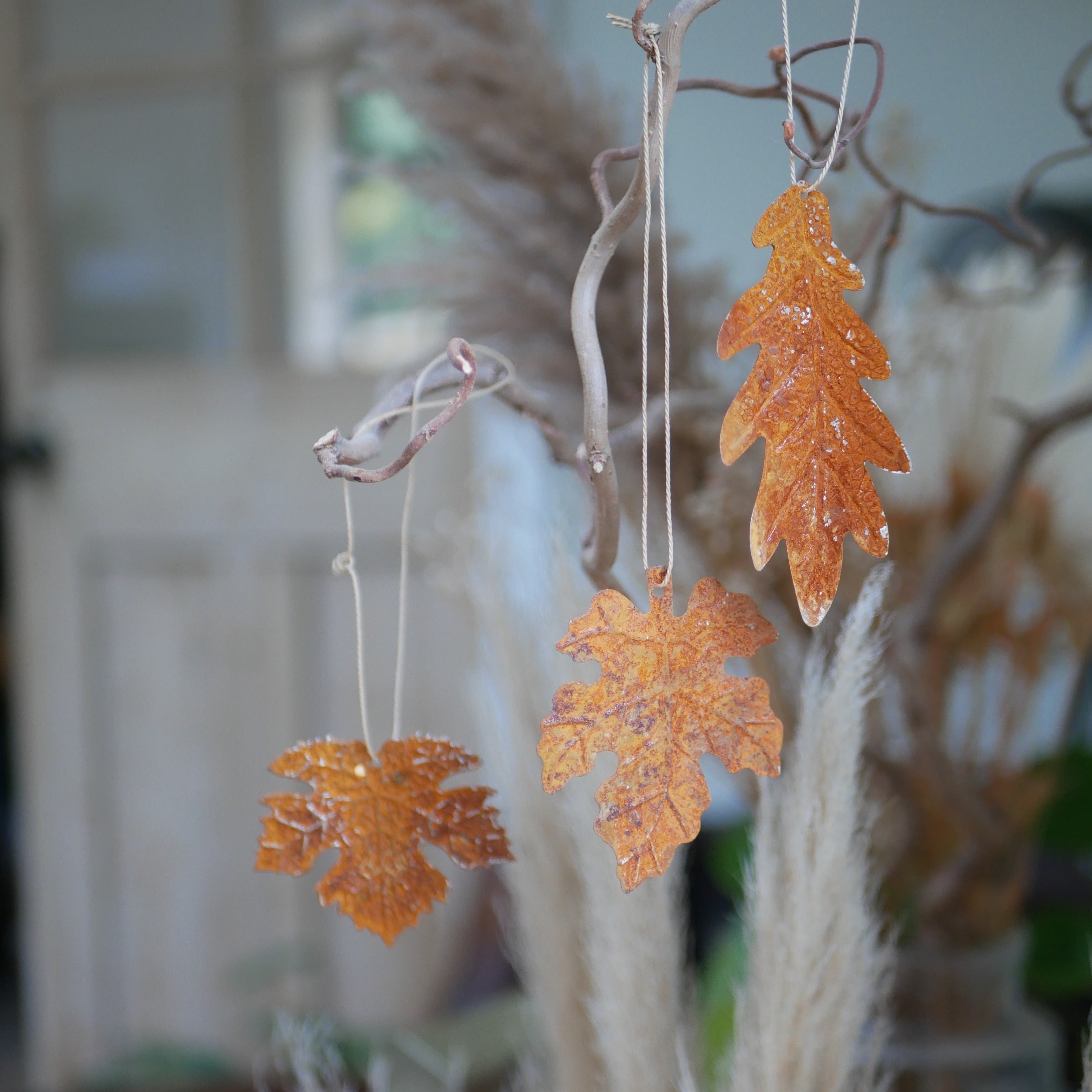 Rust effect hanging leaf decorations for autumn home styling