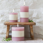 Elegant dusty pink rustic pillar candle with a textured finish and warm even burn. Available in 3 sizes for tablescapes, home décor and ambient styling.