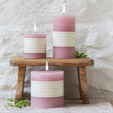 Elegant dusty pink rustic pillar candle with a textured finish and warm even burn. Available in 3 sizes for tablescapes, home décor and ambient styling.