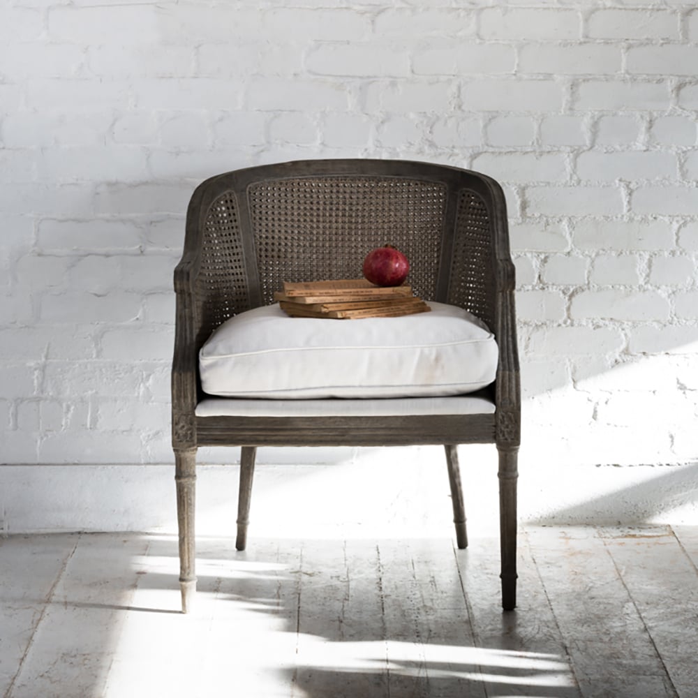 Sari ivory rattan chair with Scandinavian-inspired design for living room or bedroom styling.