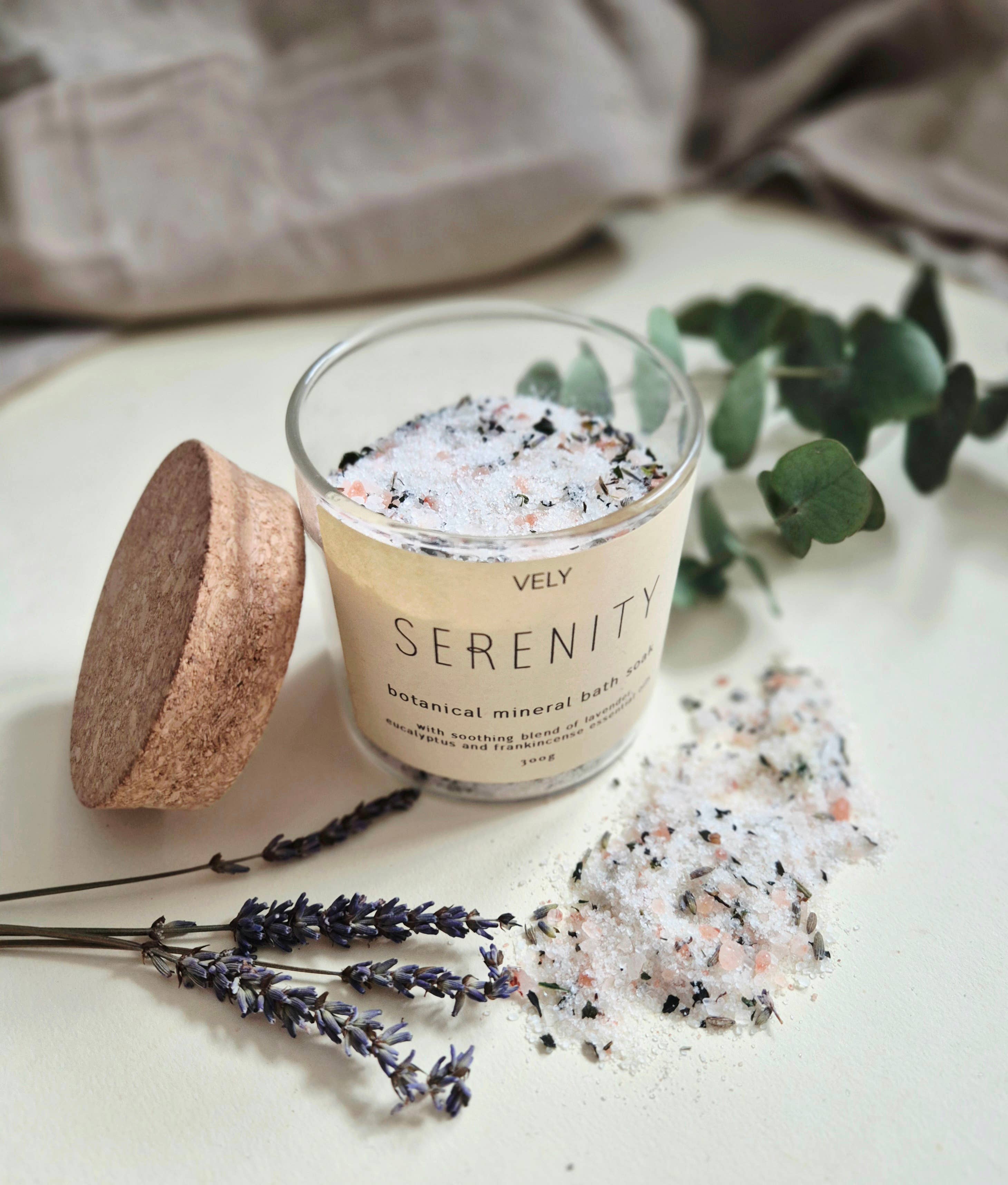 Serenity botanical mineral bath salts with lavender mint and essential oils in glass jar