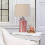 Elegant coral ceramic table lamp with a taupe shade and contemporary textured finish. A stylish statement lamp for living rooms, bedrooms and hallways.