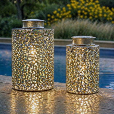 Decorative solar metal LED lantern with pierced pattern and warm metallic finish, suitable for indoor and outdoor use.