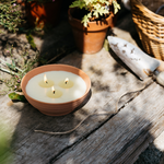 St Eval Bay and Rosemary Potager Multiwick Candle in a ribbed stoneware bowl.