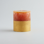 Warm and festive with orange, cinnamon and clove. St. Eval’s gold-dipped pillar candle glows with rich spice, golden light and Christmas cheer.
