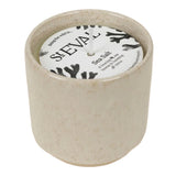 t Eval Sea Salt Sand Dune Candle, a fresh coastal fragrance of sea salt, florals, amber, oakmoss and musk in a reusable ceramic pot.