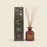St Eval Winter Thyme Christmas reed diffuser in amber glass with botanical winter fragrance