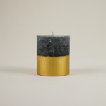 Woody, herbal and warmly festive — St. Eval’s Winter Thyme gold-dipped pillar candle blends rosemary, thyme and pine for a scent of winter greenery and cheer.