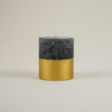 Woody, herbal and warmly festive — St. Eval’s Winter Thyme gold-dipped pillar candle blends rosemary, thyme and pine for a scent of winter greenery and cheer.