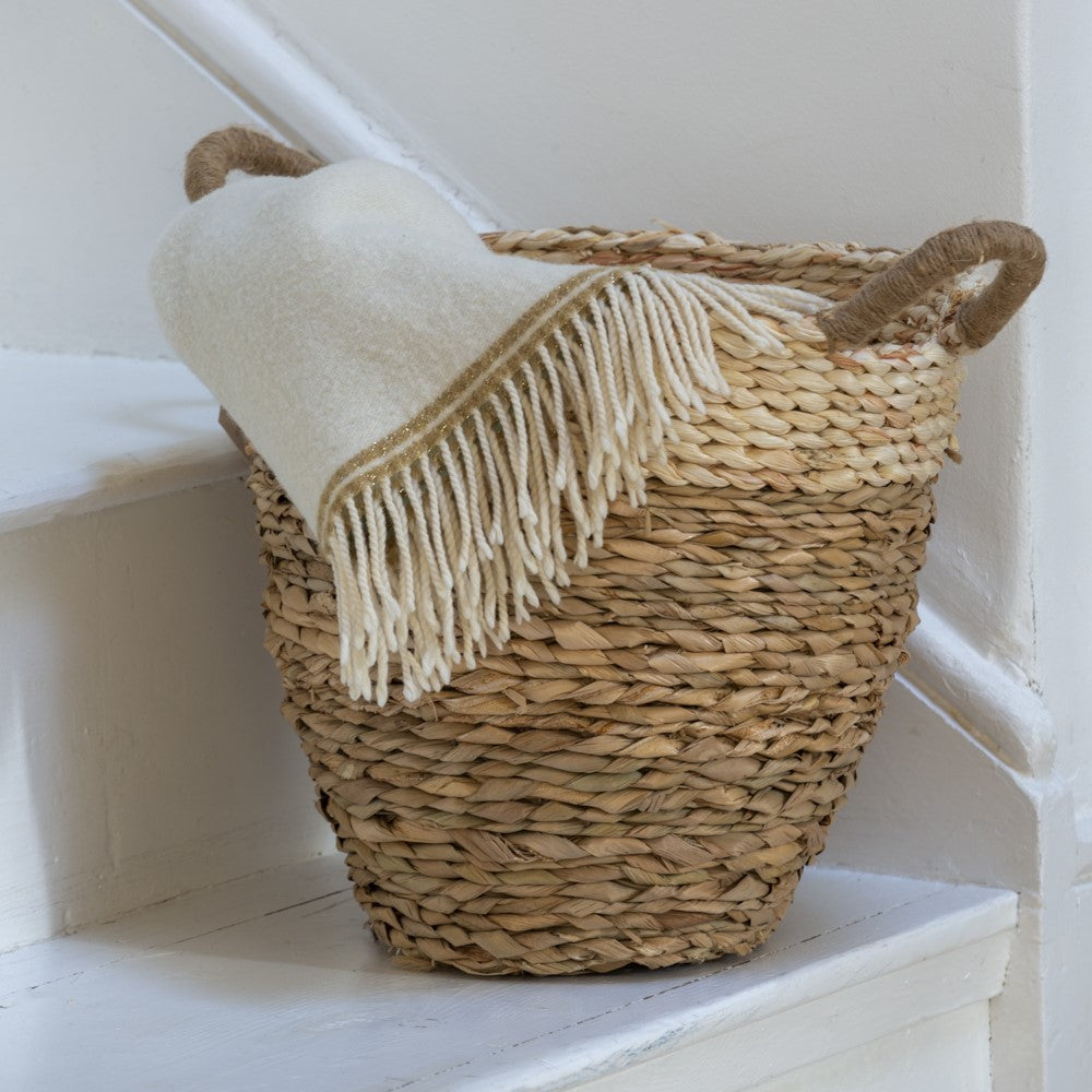Shop our Straw & Corn Woven Basket, a naturally textured striped basket perfect as a houseplant planter or stylish storage around the home.