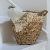 Shop our Straw & Corn Woven Basket, a naturally textured striped basket perfect as a houseplant planter or stylish storage around the home.