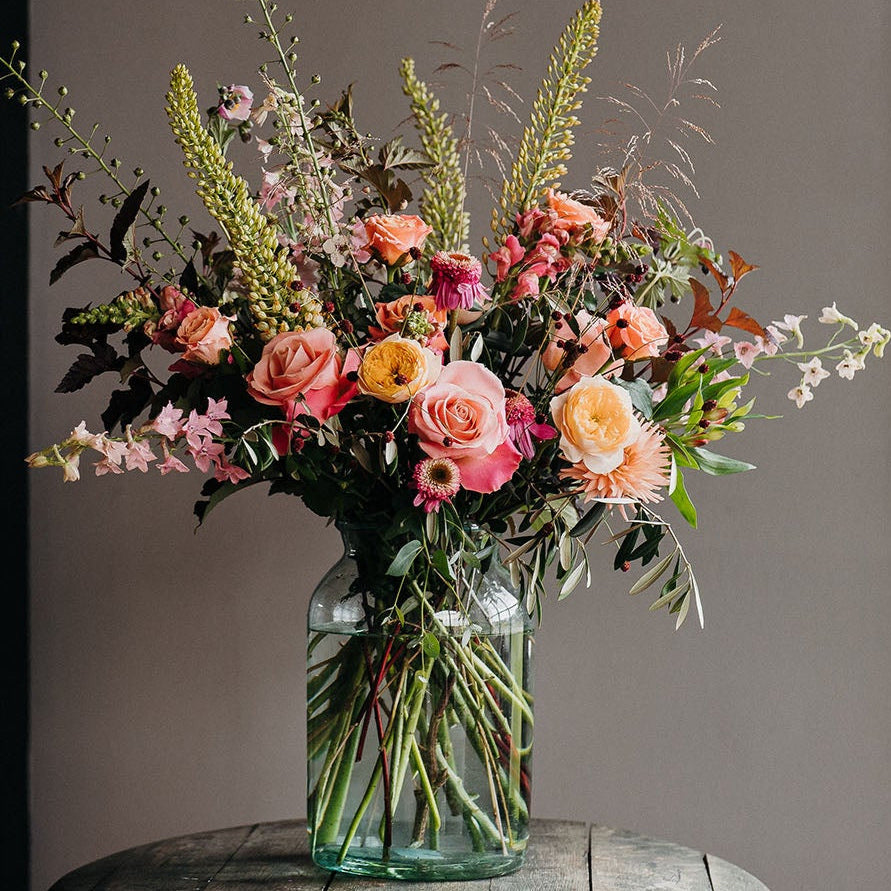 Luxury Summer Showstopper Vase by Mad Lilies featuring premium roses and seasonal summer flowers in a large glass apothecary vase.