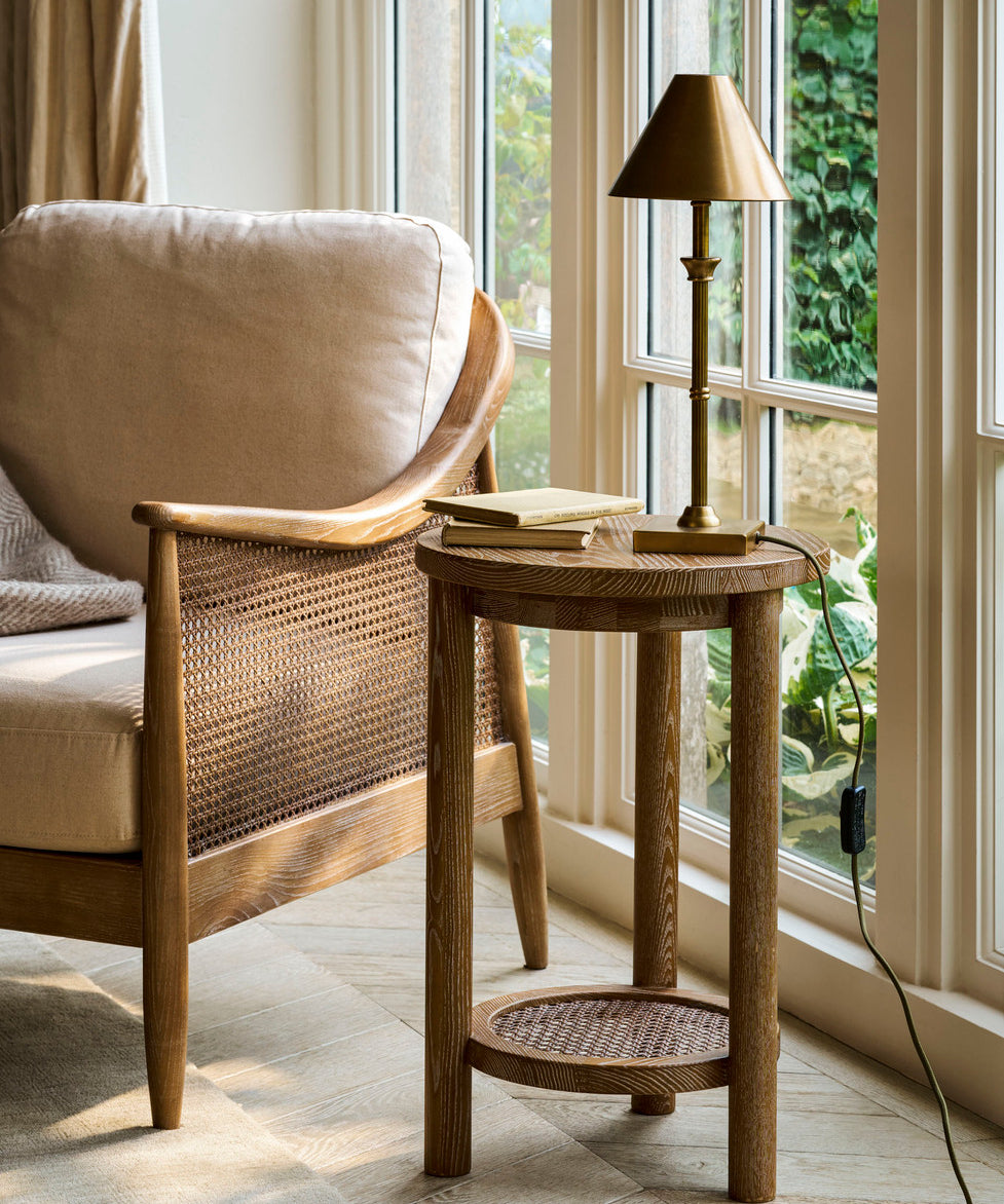 Shop the Templecombe Ash Wood Side Table, a timeless round wooden table with natural grain and practical lower shelf. Perfect beside a sofa, armchair or bed.