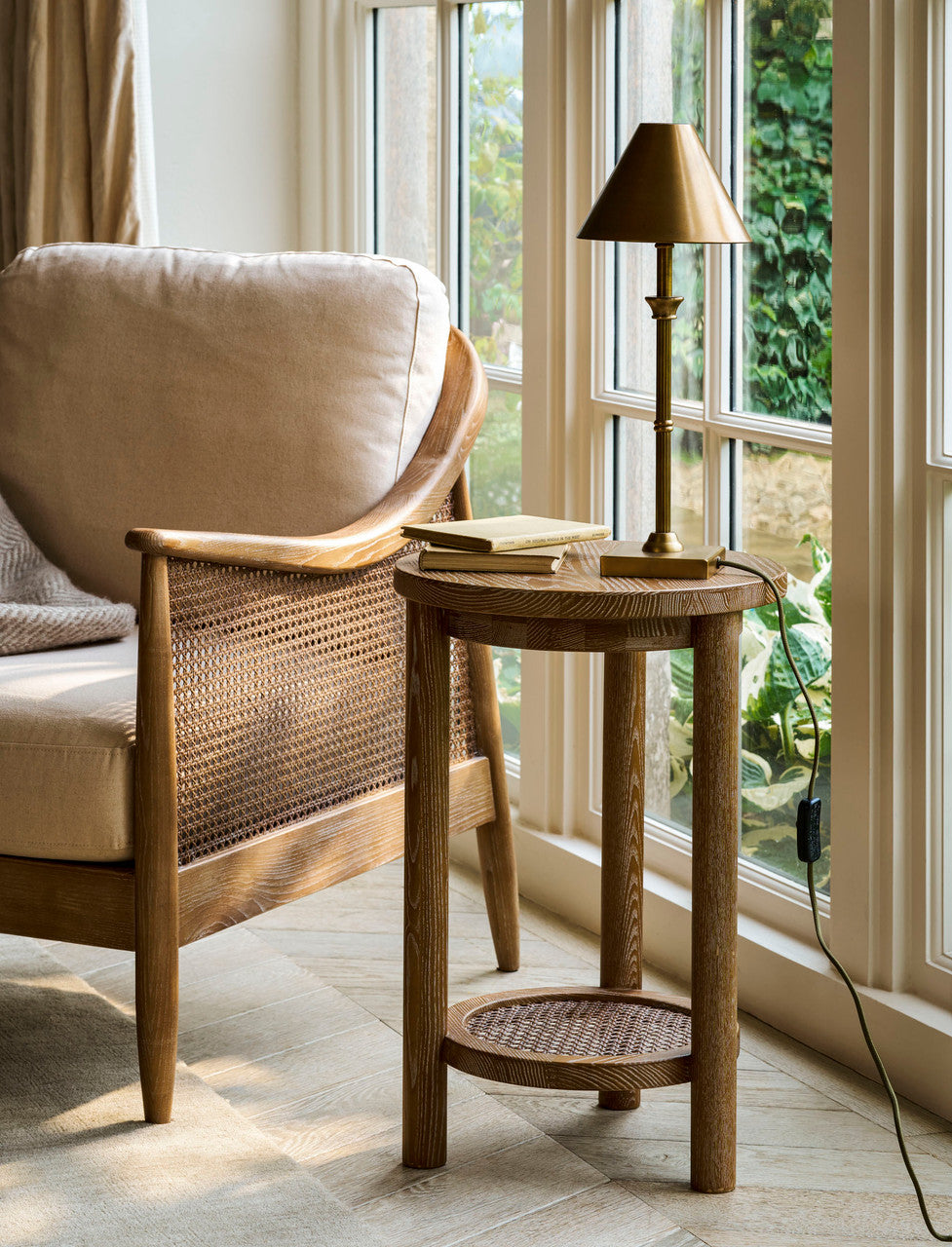Shop the Templecombe Ash Wood Side Table, a timeless round wooden table with natural grain and practical lower shelf. Perfect beside a sofa, armchair or bed.