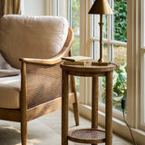 Shop the Templecombe Ash Wood Side Table, a timeless round wooden table with natural grain and practical lower shelf. Perfect beside a sofa, armchair or bed.