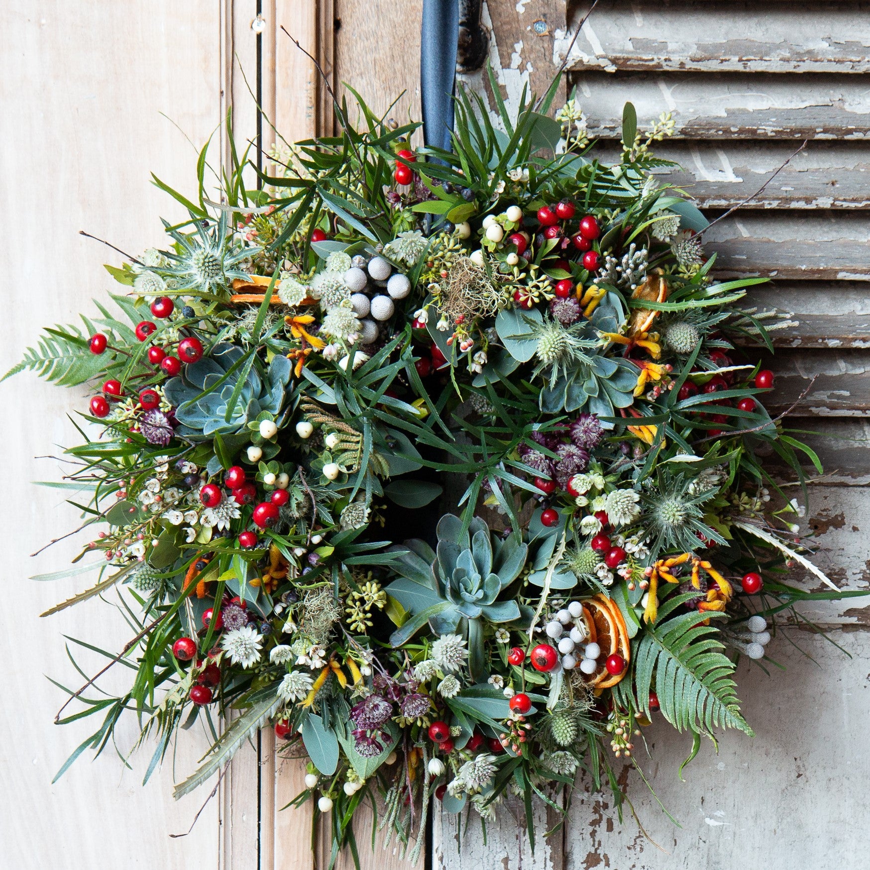 The Christmas Botanist luxury Christmas wreath with spruce, eucalyptus, ferns, berries and dried orange