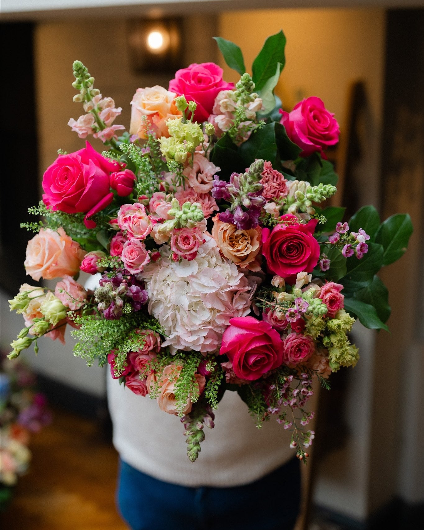 Luxury statement bouquet featuring roses, hydrangeas and seasonal flowers in an abundant garden-inspired design.