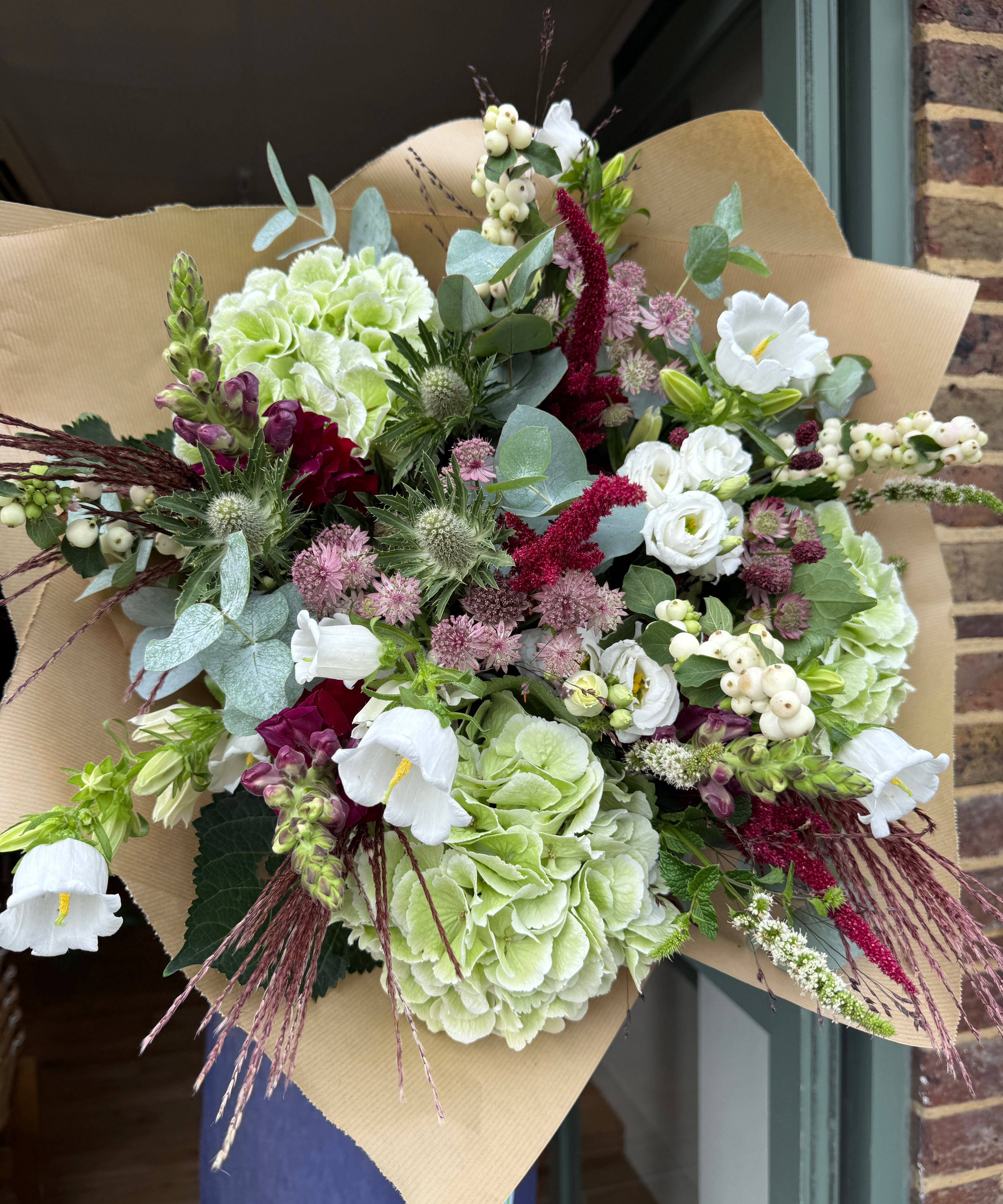The Matcha and Mulberry autumn bouquet with green hydrangeas, plum amaranthus, white snowberry and eucalyptus