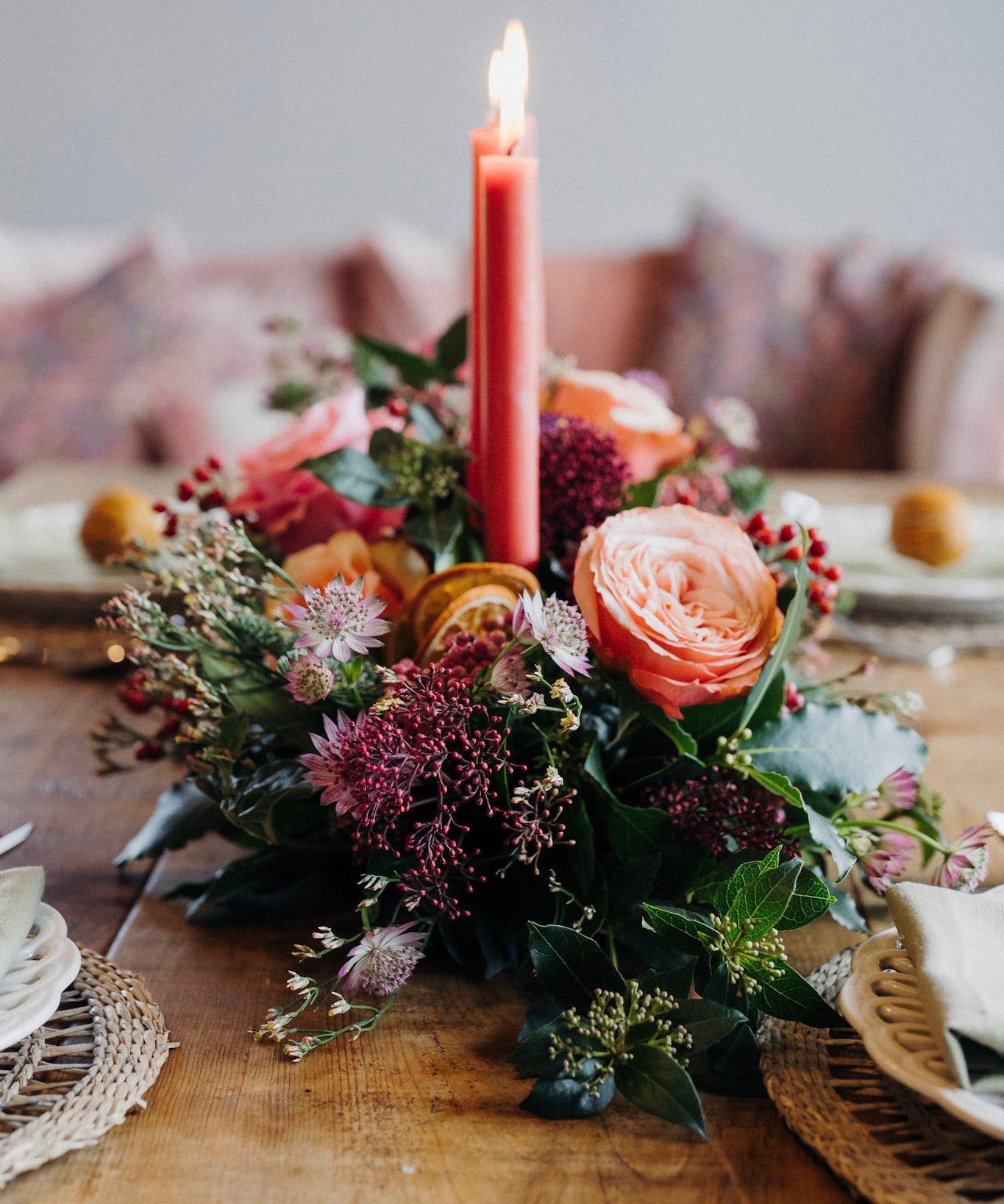 The Nutcracker luxury Christmas table flower arrangement with apricot and marsala roses, amaryllis, berries and scented winter foliage.