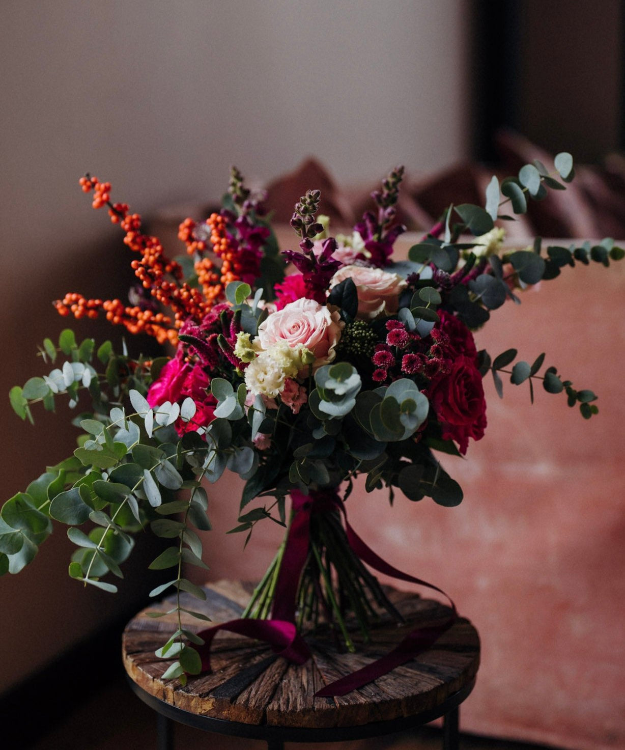 The Sugar Plum pink Christmas flower bouquet with hot pink, blush and berry-toned seasonal flowers and winter foliage.