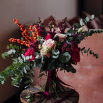 The Sugar Plum pink Christmas flower bouquet with hot pink, blush and berry-toned seasonal flowers and winter foliage.