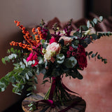 The Sugar Plum pink Christmas flower bouquet with hot pink, blush and berry-toned seasonal flowers and winter foliage.