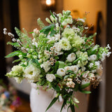 Fresh white and green seasonal flowers arranged in a natural garden style. Elegant, versatile and perfect for gifting, sympathy and celebrations.