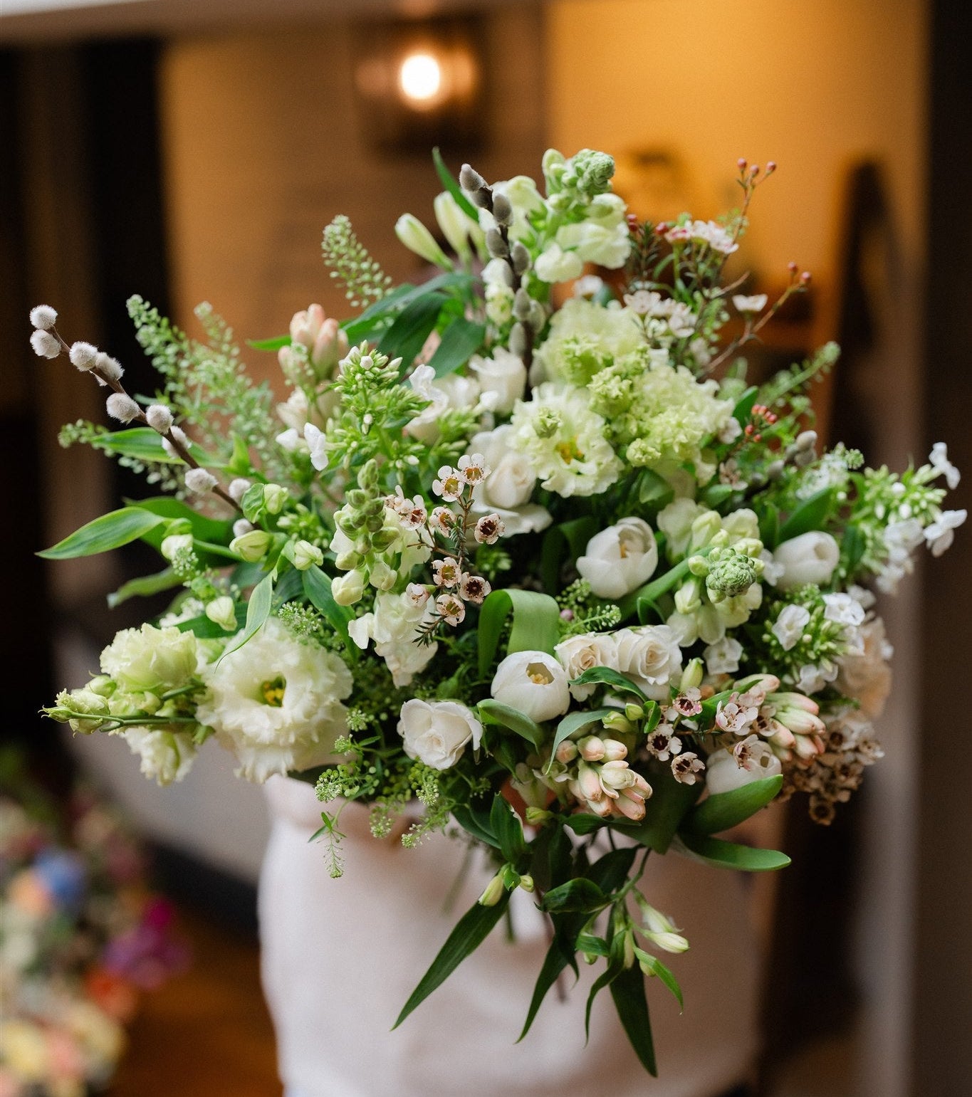 Fresh white and green seasonal flowers arranged in a natural garden style. Elegant, versatile and perfect for gifting, sympathy and celebrations.