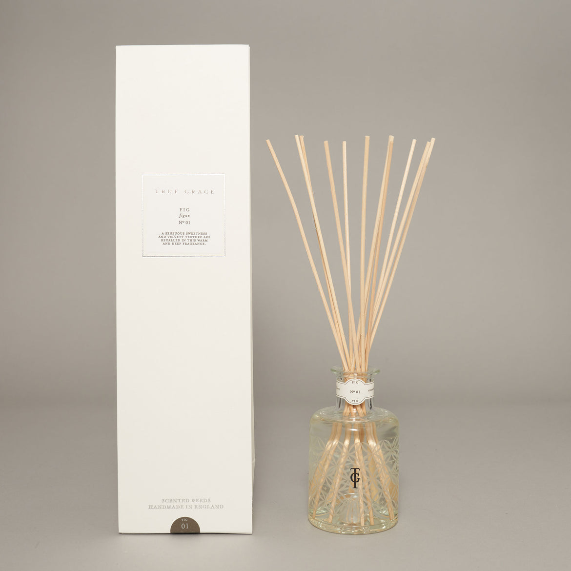 True Grace Fig reed diffuser in etched glass with notes of sweet fig, cedar and cassis for elegant home fragrance.