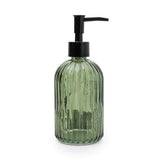 Deep green ribbed glass soap dispenser with a black pump, designed for stylish kitchen and bathroom sink areas.