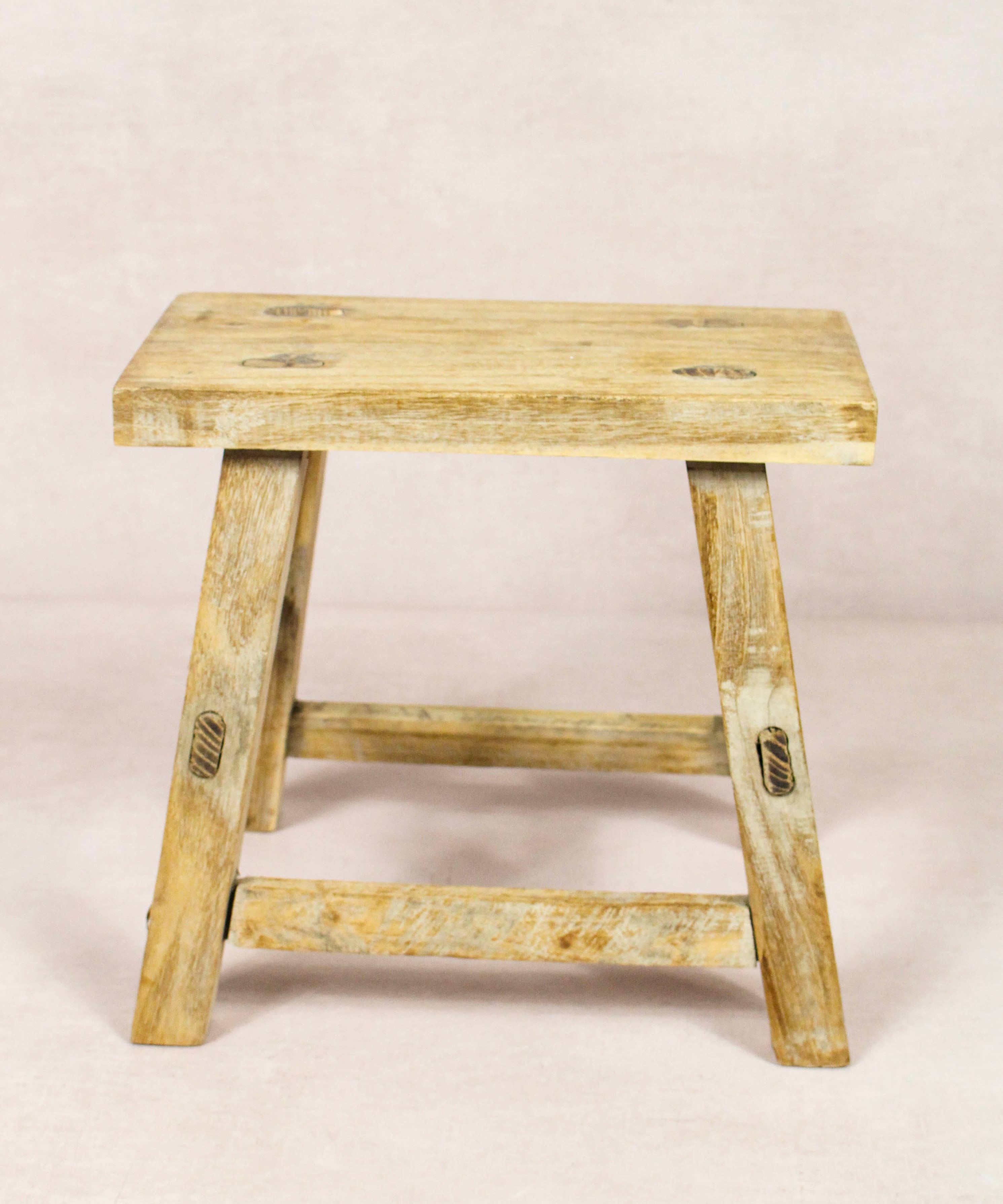 Shop our Vintage Elm Wood Stool, handcrafted from 80–100-year-old reclaimed elm. Each rustic wooden stool has its own unique grain, patina and character.