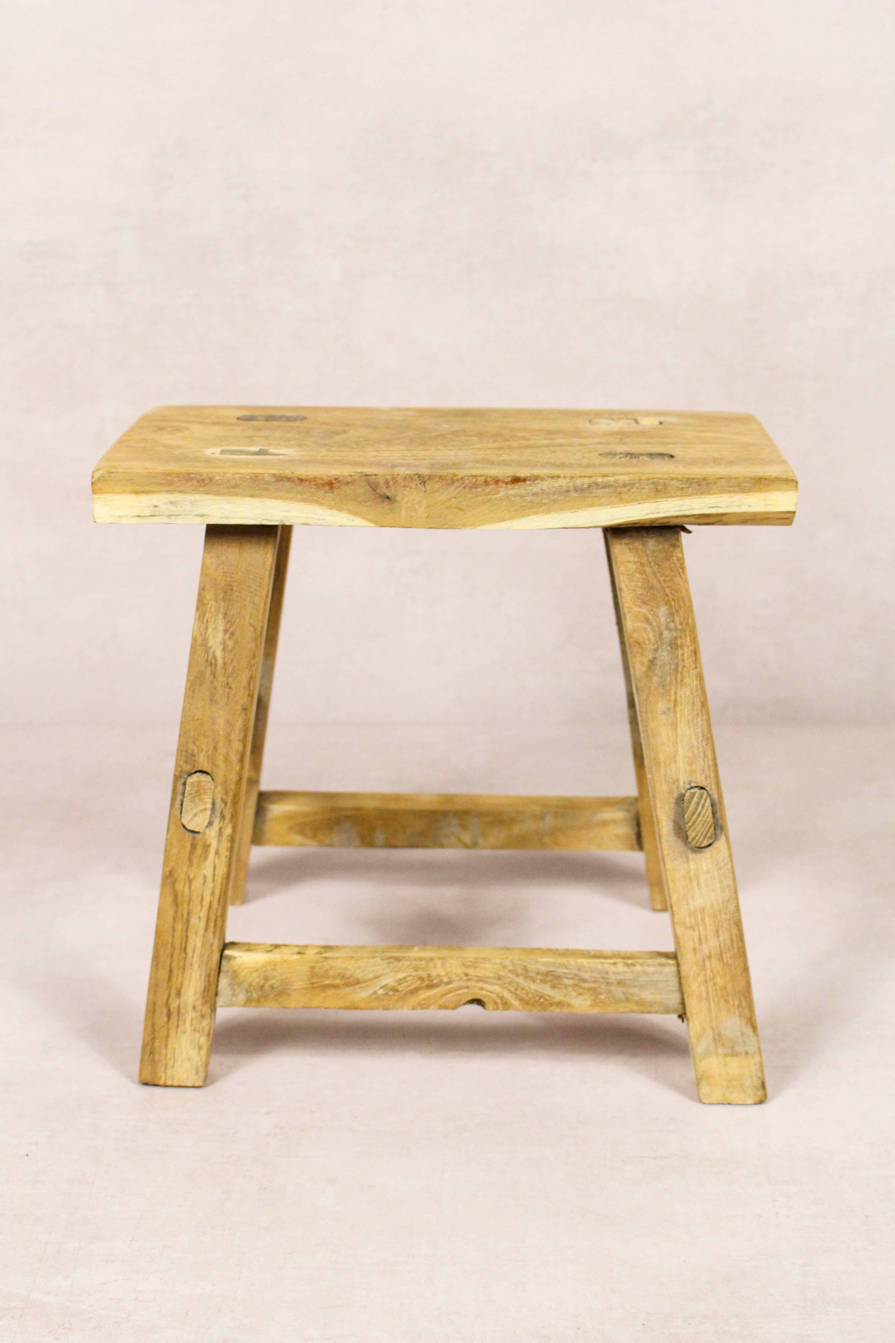 Shop our Vintage Elm Wood Stool, handcrafted from 80–100-year-old reclaimed elm. Each rustic wooden stool has its own unique grain, patina and character.