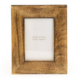 Freestanding wedge wood photo frame with a natural wooden finish for displaying photographs on shelves, desks and mantelpieces.