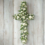 Beautiful seasonal funeral crosses handcrafted in Banstead, Surrey. Traditional floral cross tributes created with care, using seasonal flowers and foliage.