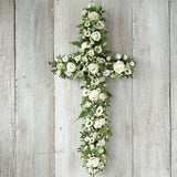 Beautiful seasonal funeral crosses handcrafted in Banstead, Surrey. Traditional floral cross tributes created with care, using seasonal flowers and foliage.