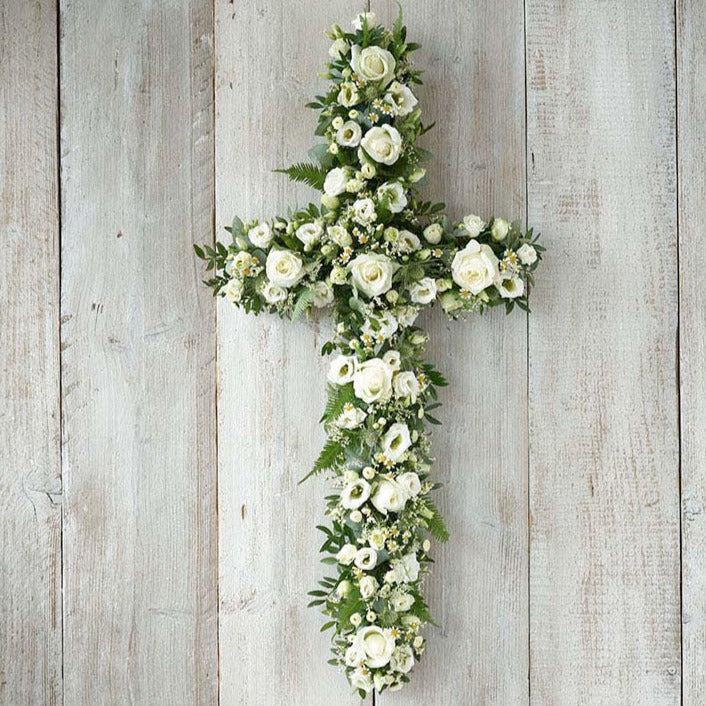 Beautiful seasonal funeral crosses handcrafted in Banstead, Surrey. Traditional floral cross tributes created with care, using seasonal flowers and foliage.