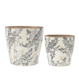 Wikholme Elin grey and white ceramic indoor plant pot styled with a houseplant in a modern home interior.