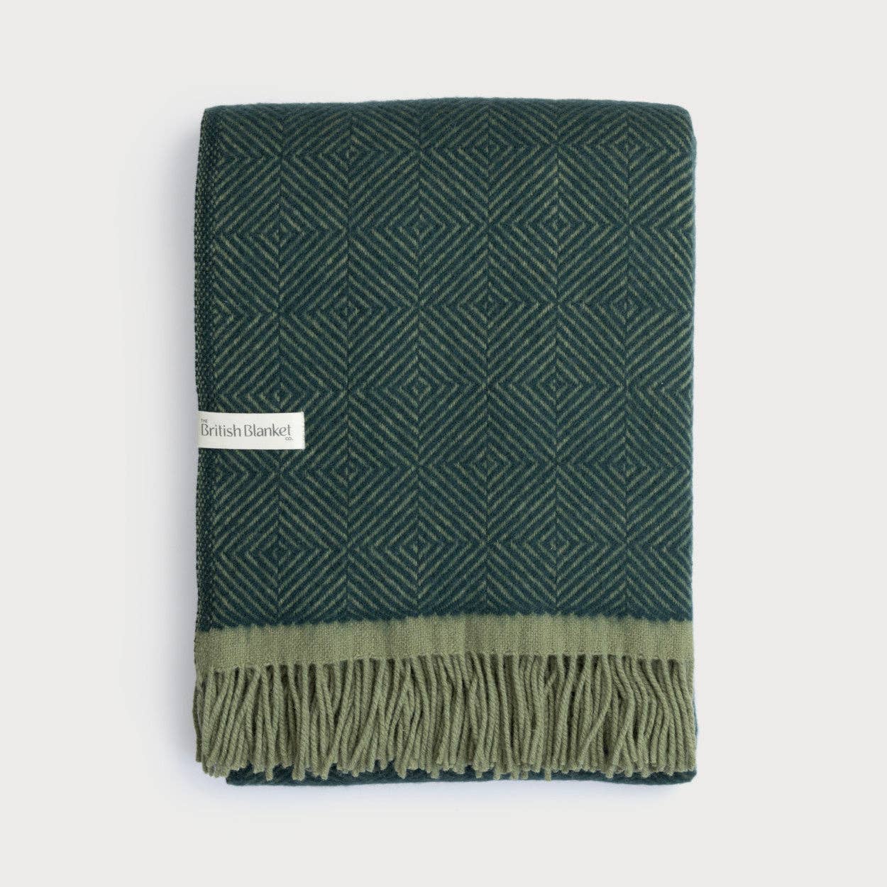 Wildweave Juniper and Moss pure sheep's wool blanket in deep green woodland tones