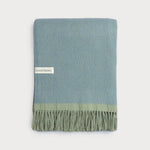 Wildweave Sea Holly and Lichen pure wool blanket in dusty blue and muted green