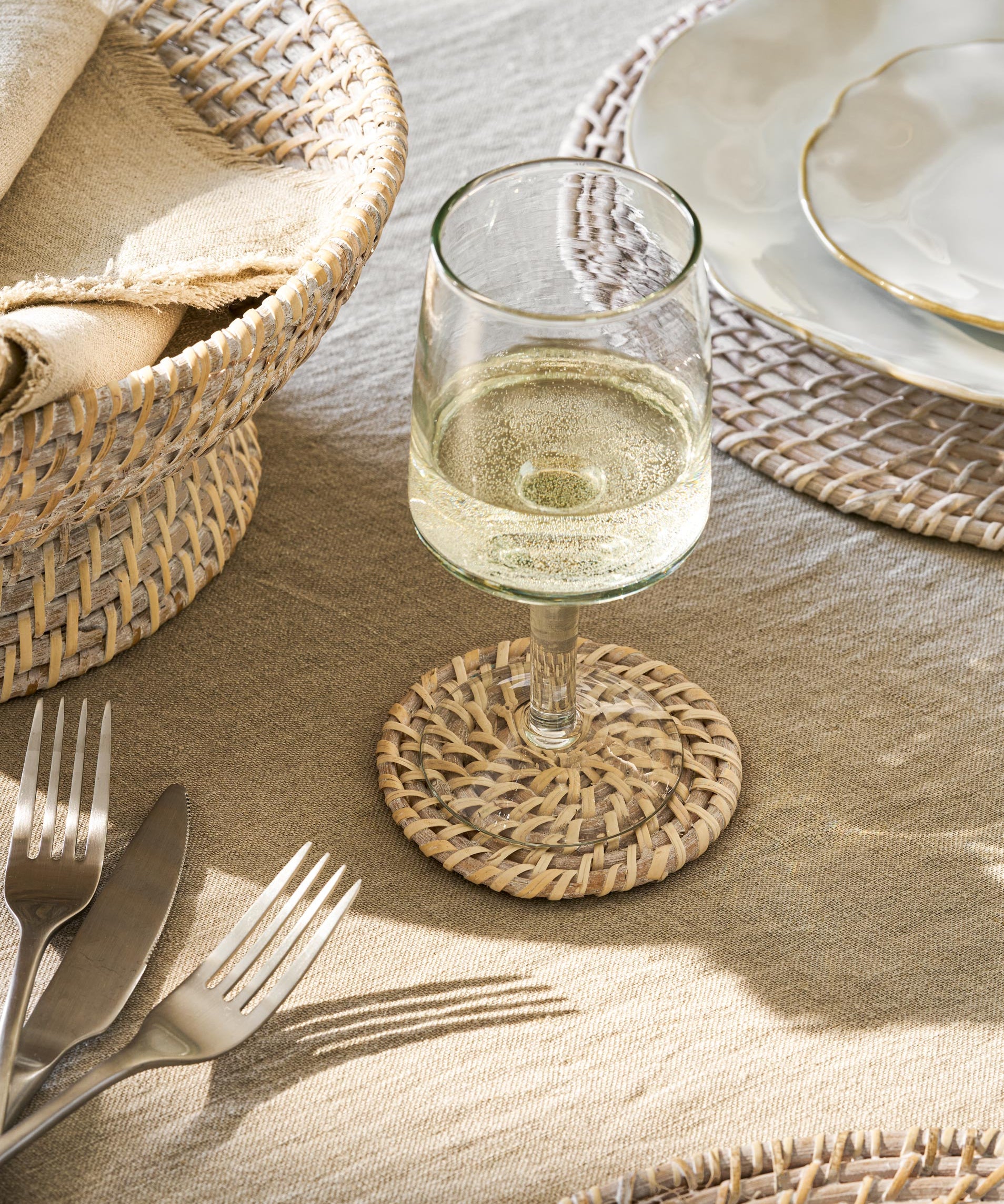 Wittering Set of 4 handwoven rattan coasters with whitewash finish.
