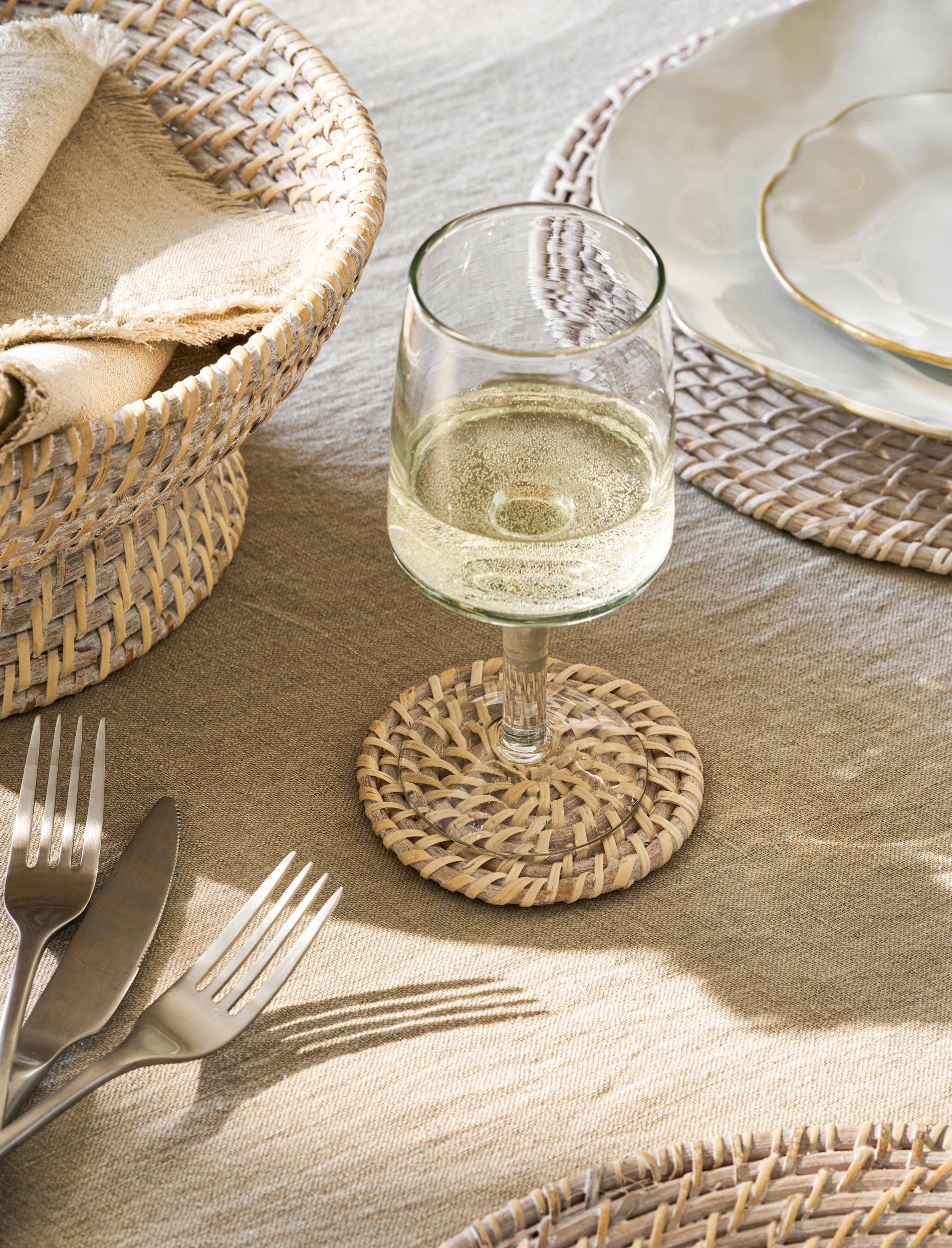 Wittering Set of 4 handwoven rattan coasters with whitewash finish.