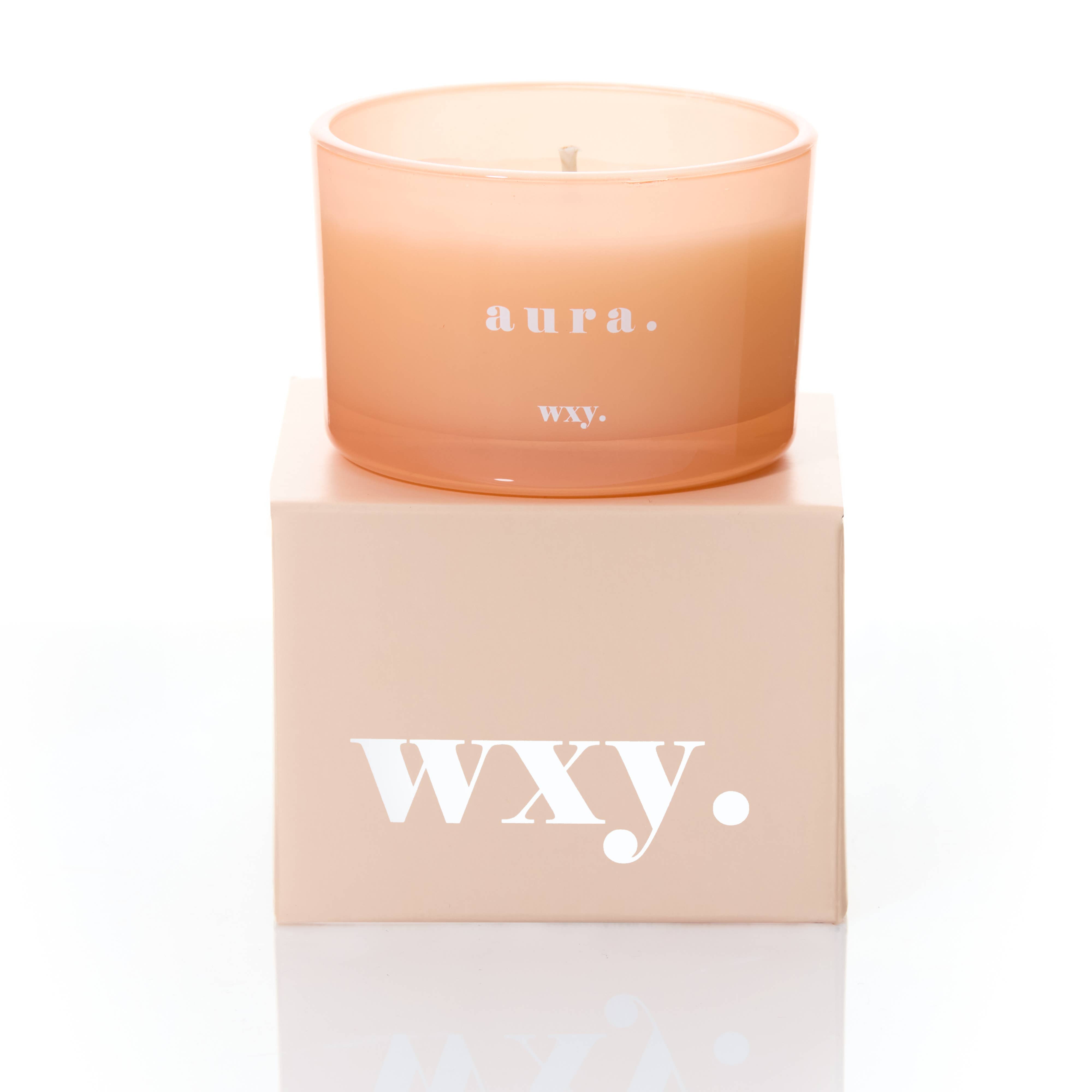 WXY Aura scented candle with White Woods and Amber fragrance, hand-poured in the UK.