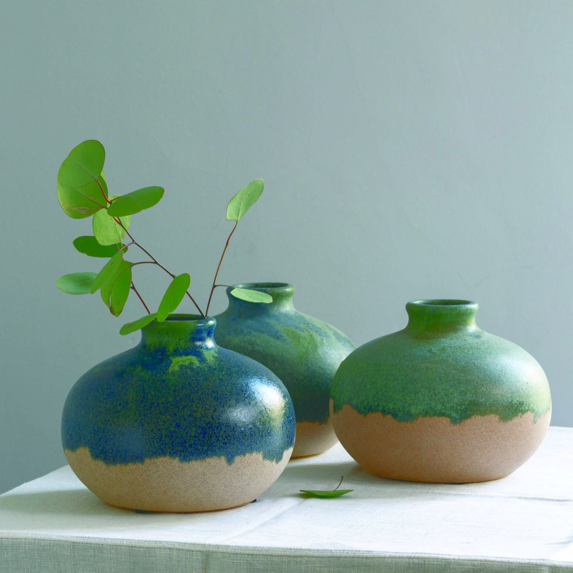 Unique blue and green dipped ceramic vase with a distressed artisan finish. Perfect for displaying stems, shelves and relaxed contemporary interiors.