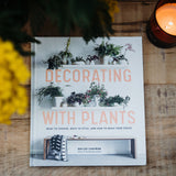 Decorating with Plants hardback by Baylor Chapman featuring houseplant styling inspiration, indoor plant care advice and over 350 colour photographs of beautiful plant-filled interiors.