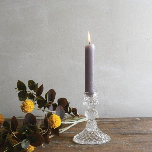 Shop our Harlequin Clear Glass Candlestick, a small sculptural candle holder designed to pair beautifully with coloured dinner candles.