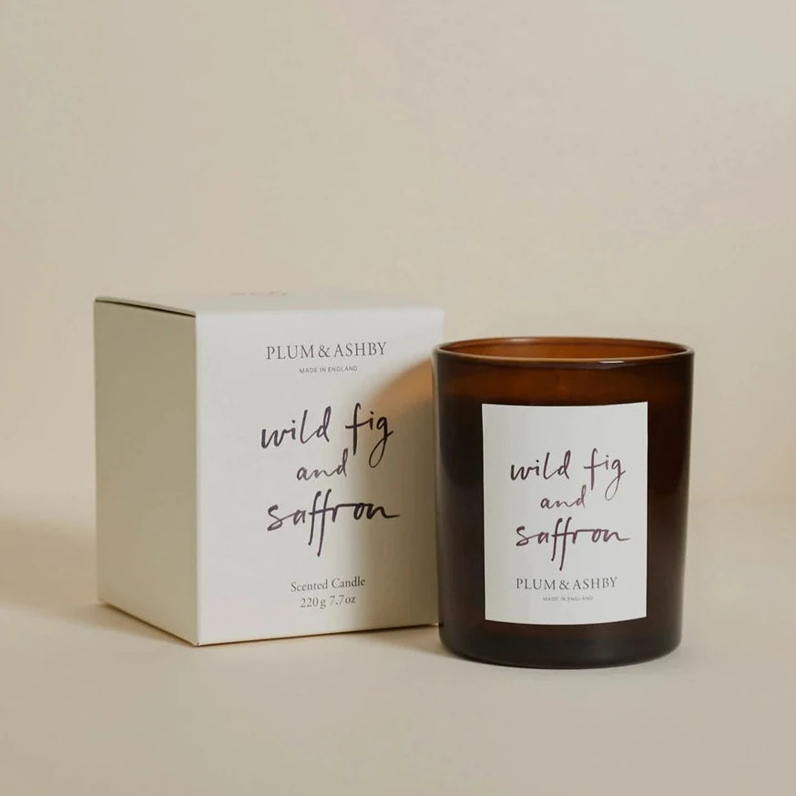 Plum & Ashby Wild Fig & Saffron Candle in a glass vessel. A hand-poured natural soy wax candle with wild fig, blackcurrant, saffron, soft amber and musk, creating a rich, warm fragrance with up to 60 hours of clean, even burn time.