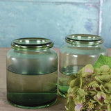 Decorative recycled green glass apothecary vase perfect for foliage, fairy lights and shelf styling. A timeless glass jar vase for elegant interiors.