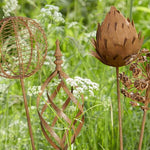 Decorative rust iron garden stakes with floral-inspired designs. Add height, texture and rustic charm to borders, pots and garden beds.