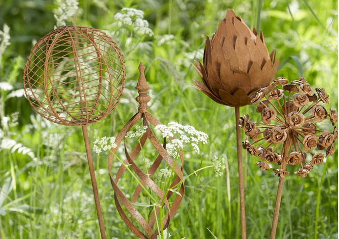 Decorative rust iron garden stakes with floral-inspired designs. Add height, texture and rustic charm to borders, pots and garden beds.